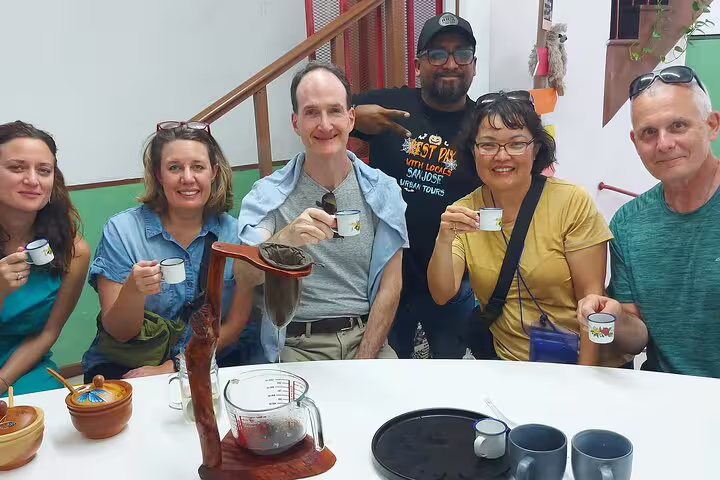 A group of tourists savor traditional Costa Rican coffee on the San Jose Bites and Sights Walking Food Tour.