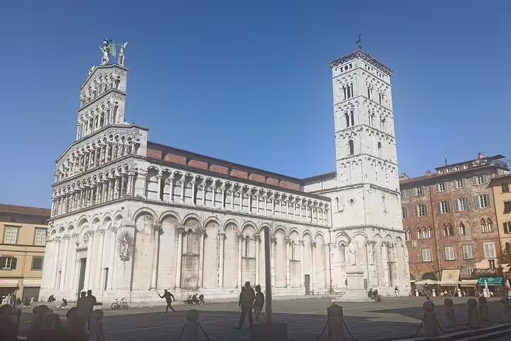 Romanesque San Michele in Foro church in Lucca bathed in sunshine, a highlight of private Pisa and Lucca wine tour
