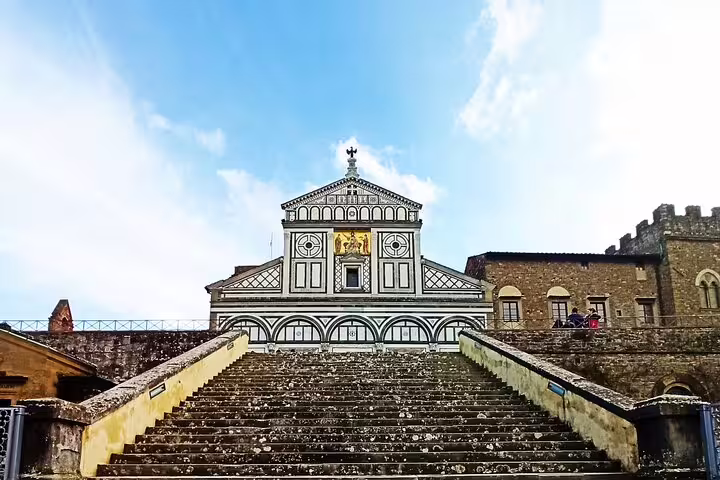 Stone steps leading to the ornate San Miniato al Monte basilica above Florence, visited on a La Spezia and Carrara day tour