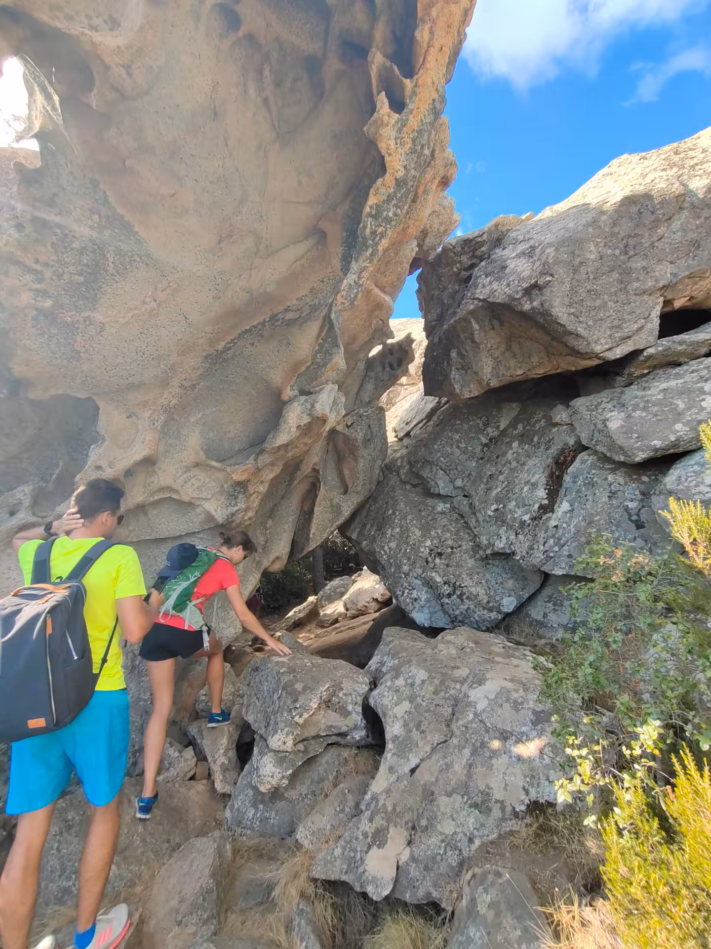 Adventurous hikers explore rugged rock formations on a jeep tour to Rio Pitrisconi in San Teodoro.