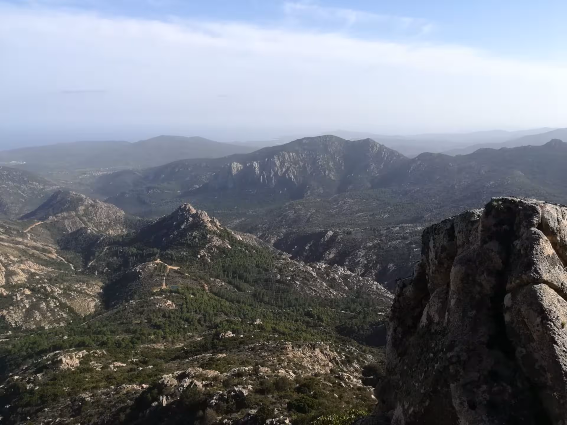 Breathtaking panoramic view of rugged Sardinian mountains on the San Teodoro trekking route to Rio Pitrisconi.