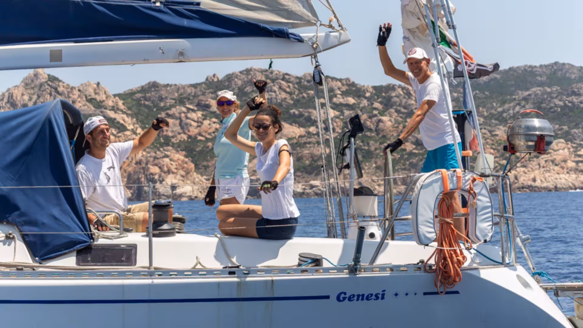 Group enjoying a sunny day on a sailing boat near San Teodoro's stunning coastline, ideal for a sailing tour.