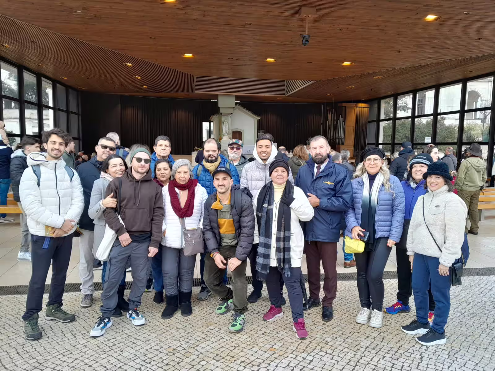Visitors gather at the Sanctuary of Fátima, enjoying a guided tour highlighting its spiritual and historical significance.