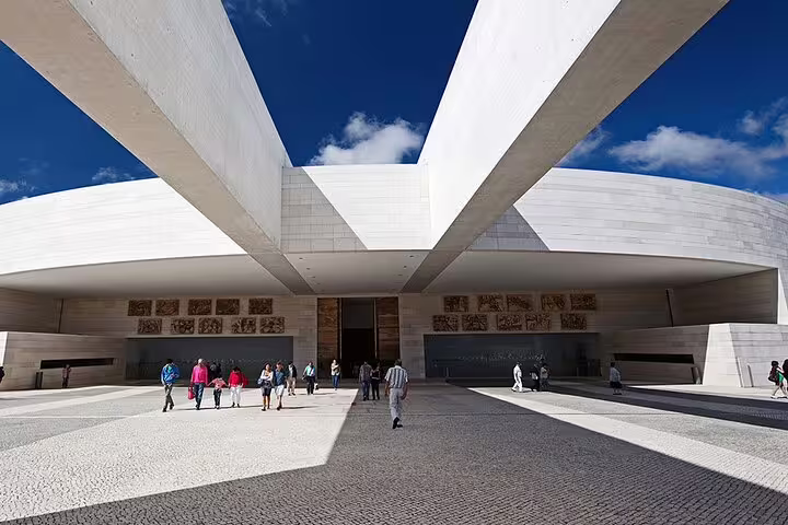 Visitors exploring the modern architecture of the Sanctuary of Fátima, a key destination on the Lisbon tour.