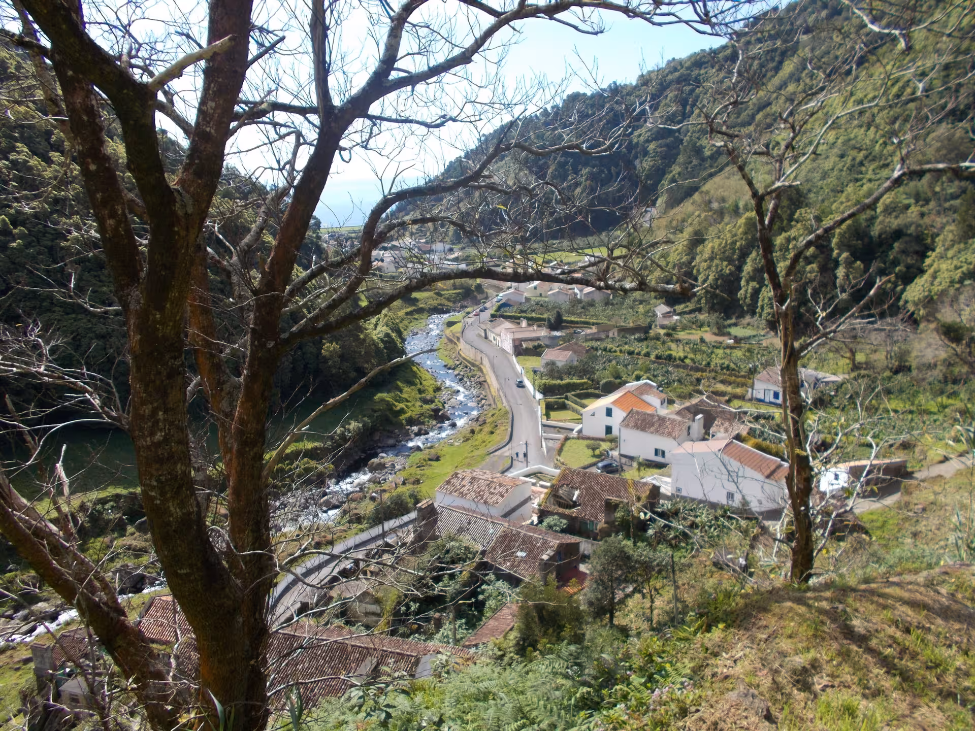 Scenic valley view of Sanguinho village and river from hillside lookout on the all-day walking tour, Azores