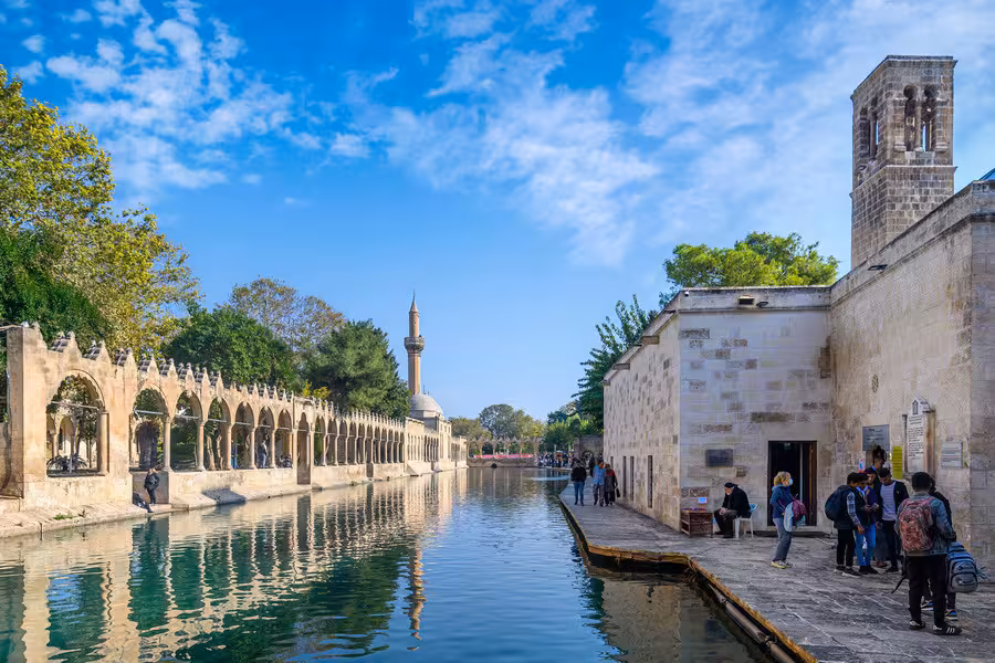 Şanlıurfa Balıklıgöl sacred fish lake and mosque walkway, key stop on 5-day Mesopotamia tour by plane
