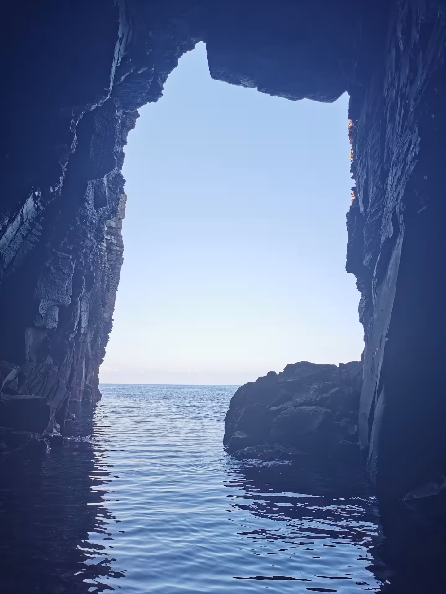 Discover a breathtaking sea cave opening to the horizon on the Sant'Antioco 4-hour RIB adventure tour.