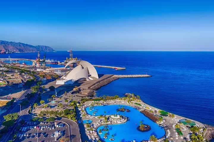 Stunning view of Santa Cruz de Tenerife's coastal architecture and pools, featured in the 6-hour private tour.