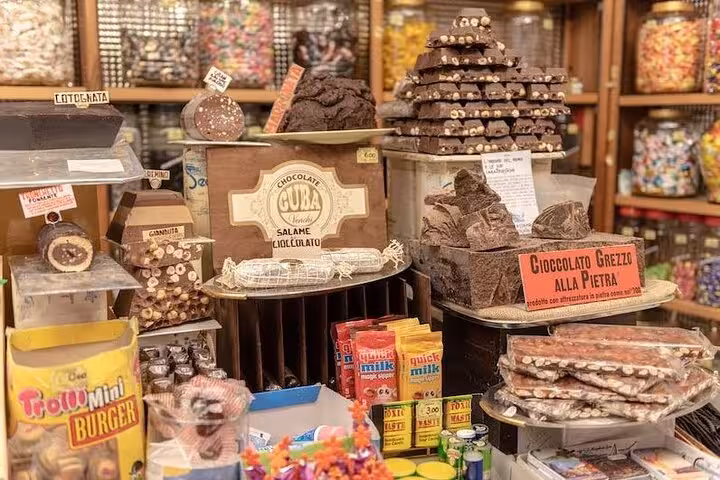 Assorted chocolates and sweets on display in a Santa Margherita shop, showcasing Ligurian delicacies for food tour enthusiasts.