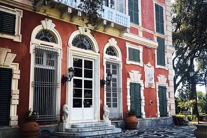 Elegant historic villa in Santa Margherita with vibrant facade, ideal stop on Ligurian Riviera food tour.