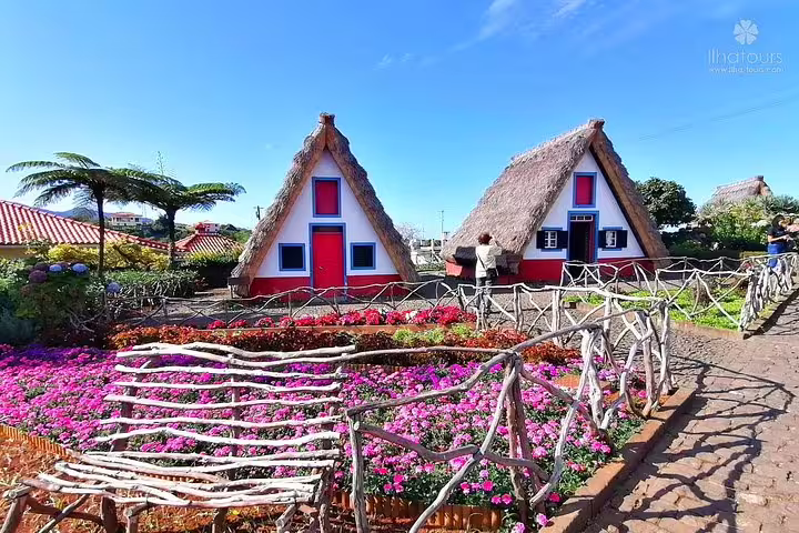 Traditional Santana houses with thatched roofs and colorful gardens in Madeira showcase the island's unique cultural heritage.