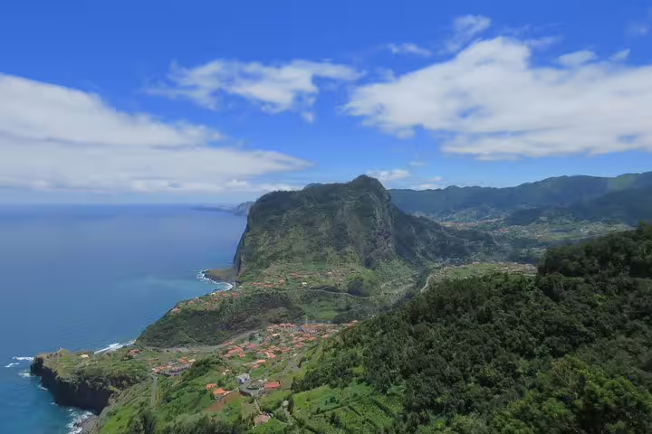 Scenic view of lush green cliffs and coastline in Santana, Madeira, perfect for a thrilling Northeast 4x4 shore excursion.