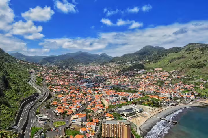 Aerial view of Santana with lush green peaks and coastline, perfect for the adventurous 4x4 tour in Madeira's stunning landscape.