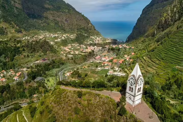Explore breathtaking views of Madeira's lush valleys and coastal villages on the Full Day Santana Wonders and Northeast 4WD Experience.