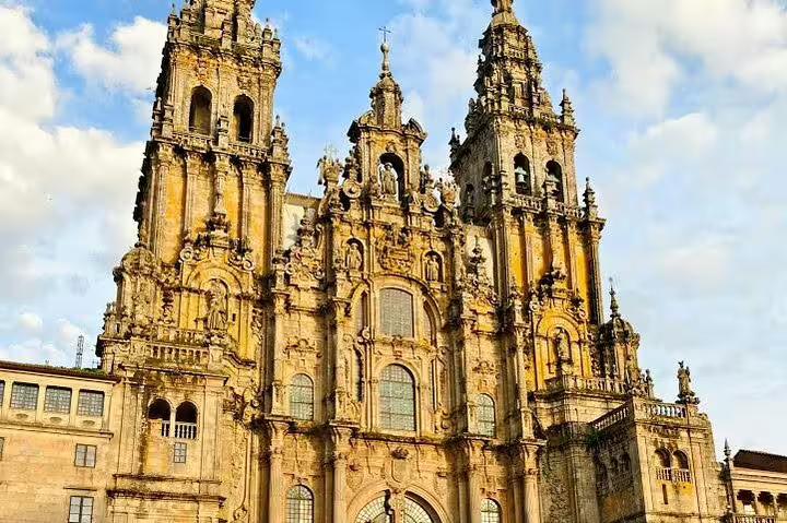 Explore the stunning façade of Santiago de Compostela Cathedral on a full-day tour from Porto to Santiago and Valença do Minho.