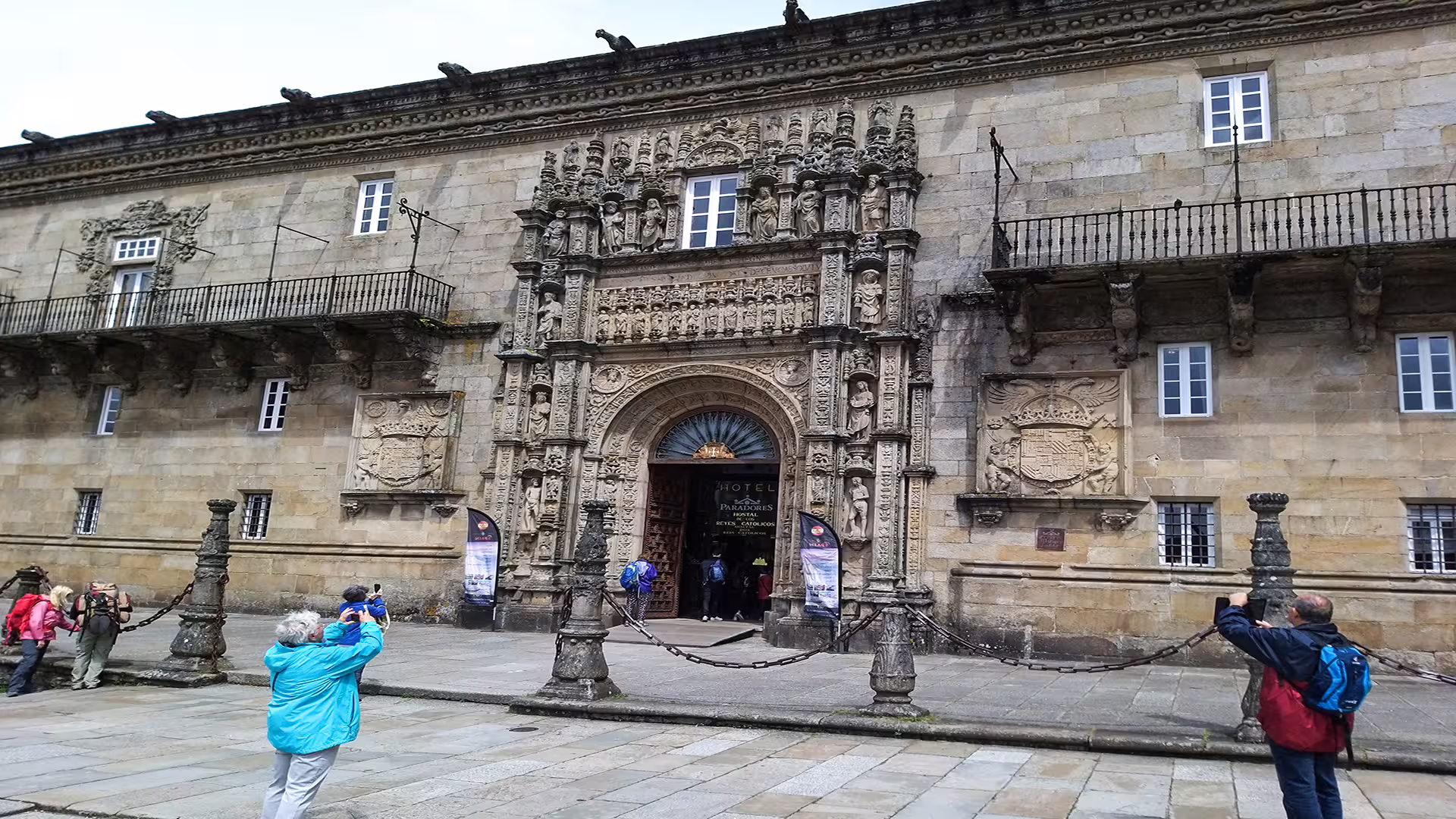 Tourists admire the ornate facade of Santiago de Compostela Cathedral, a highlight of Galicia's cultural and historic tours.