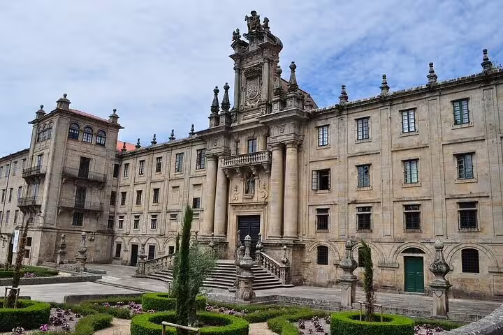 Historic monastery facade and gardens in Santiago de Compostela on a private day trip from Porto to Spain