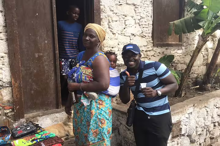 Friendly local welcome in Cidade Velha, Santiago Island, after 1-way private airport transfer from Praia Airport