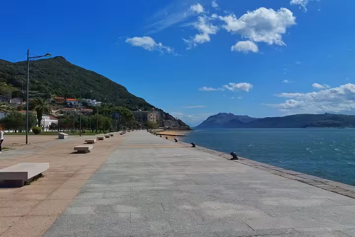 Scenic coastal promenade in Santoña with views of the bay and lush hills, ideal for a relaxing stroll.