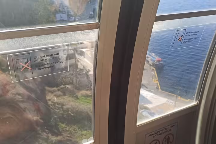 Cable car view over Santorini caldera and Athinios port, ideal start for Oia cruise shore excursion