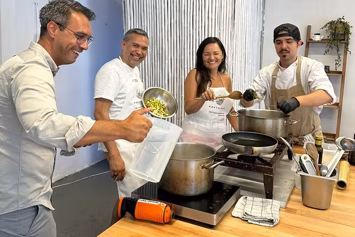 Couple joins Santorini cooking class honeymoon experience, preparing Greek dishes before 2 winery tastings