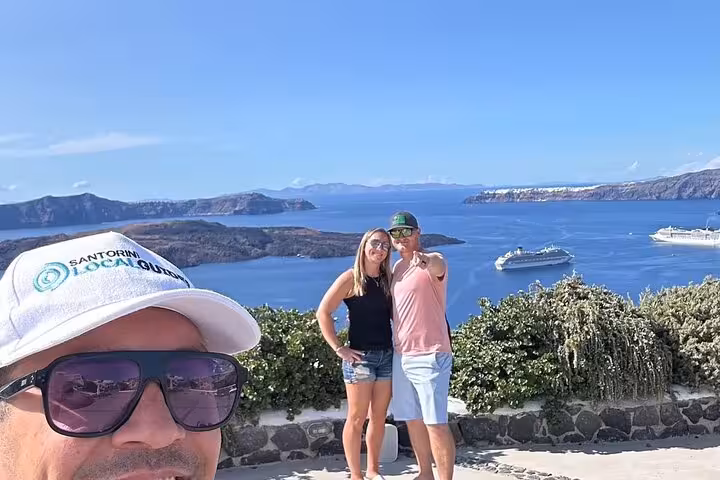 Santorini one-day tour from cruise ship with caldera viewpoint selfie and cruise ships anchored in the bay