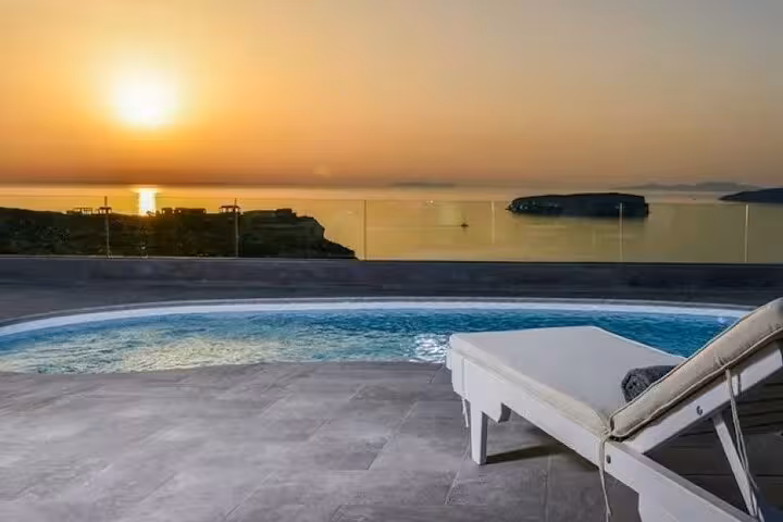 Santorini luxury villa stay with private pool and sunset caldera view, included transport for day getaway