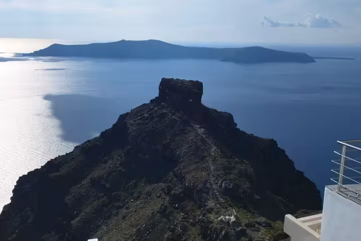 Santorini caldera lookout near Oia with rugged volcanic islet and Aegean sea views on a cruise shore excursion