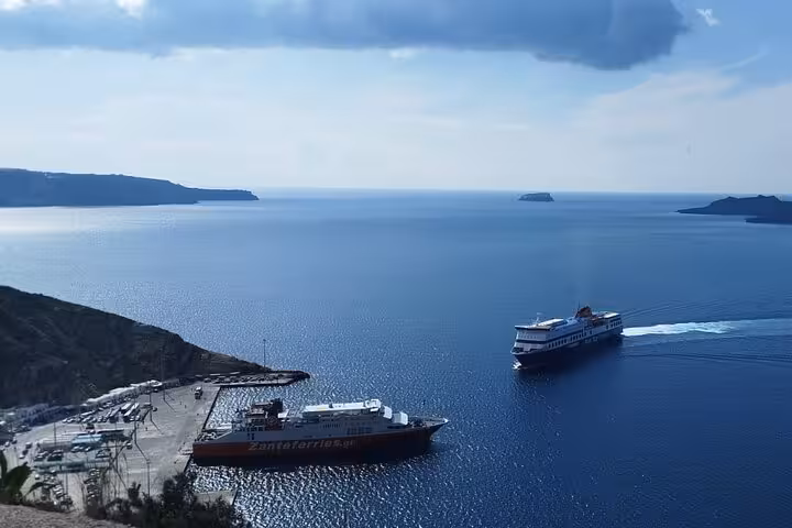 Santorini port ferries on the Aegean Sea, ideal for private chauffeur transfer to Athinios ferry terminal