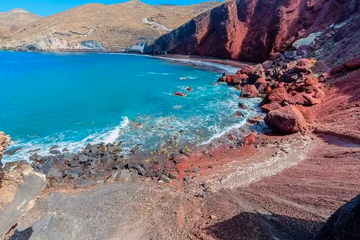 Santorini Red Beach coastline with volcanic cliffs and turquoise water on a private tour from Athens
