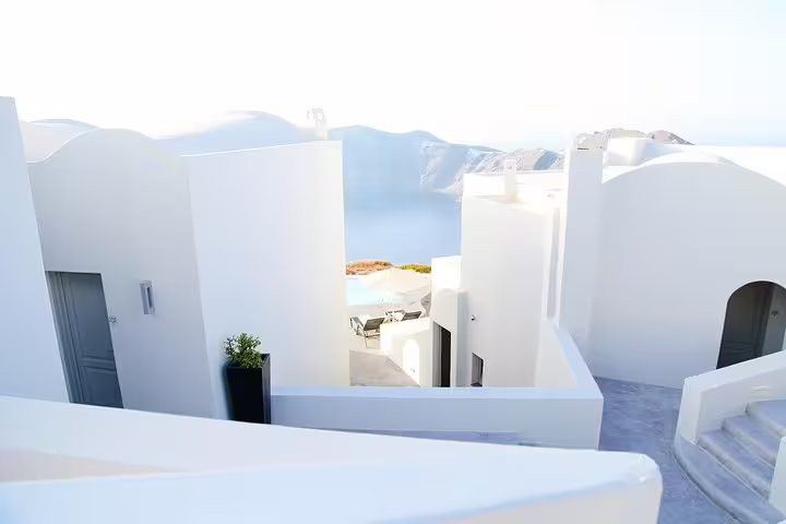Scenic view of Santorini's iconic whitewashed buildings and caldera, perfect for a private full-day sightseeing tour.