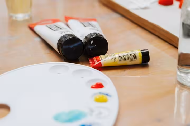 Acrylic paints and palette set up for Santorini wine and paint adventure, perfect for a paint and sip experience