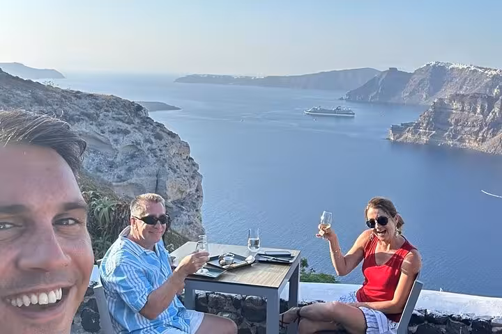 Santorini caldera view wine tasting on a terrace, private winery tour with Wine Museum stop and snack pairings