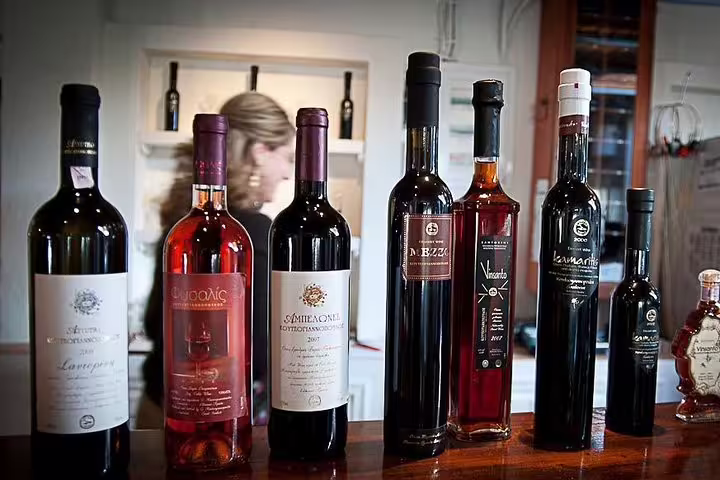 A selection of Santorini wines on display during a private night tour, showcasing local flavors and vineyard experiences.