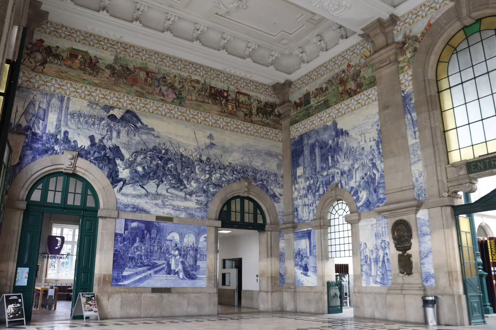 São Bento train station interior with iconic blue azulejo tiles depicting historical scenes, featured on Porto private afternoon tour.
