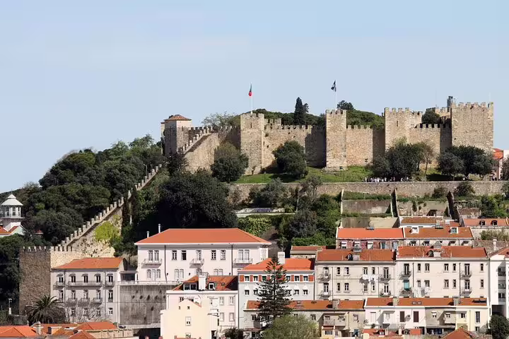 São Jorge Castle overlooking Lisbon rooftops, a highlight viewpoint on a self-guided GPS and audio tour