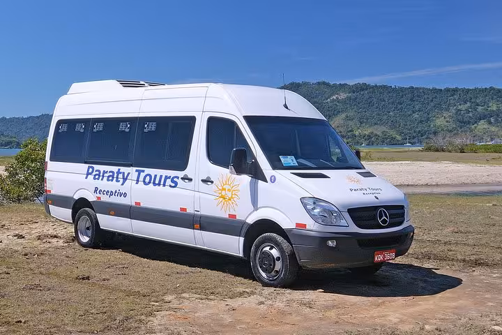 Comfortable Paraty Tours shuttle van ready for shared transport from São Paulo to Paraty, featuring scenic views.