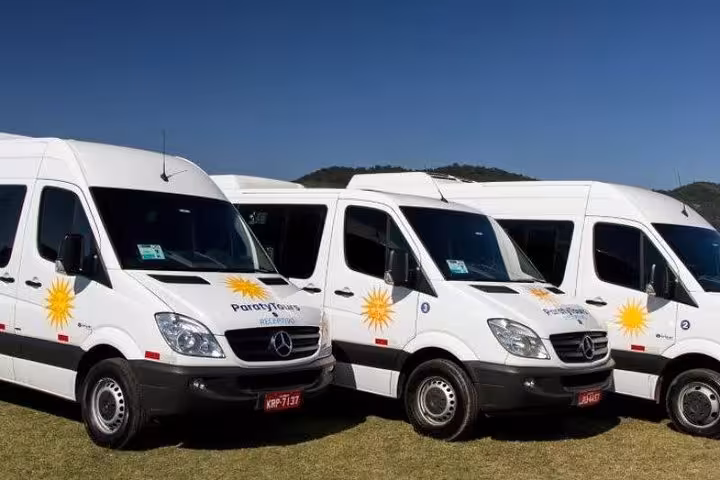Fleet of Paraty Tours shuttle vans ready for service from São Paulo to Paraty, offering comfortable travel.
