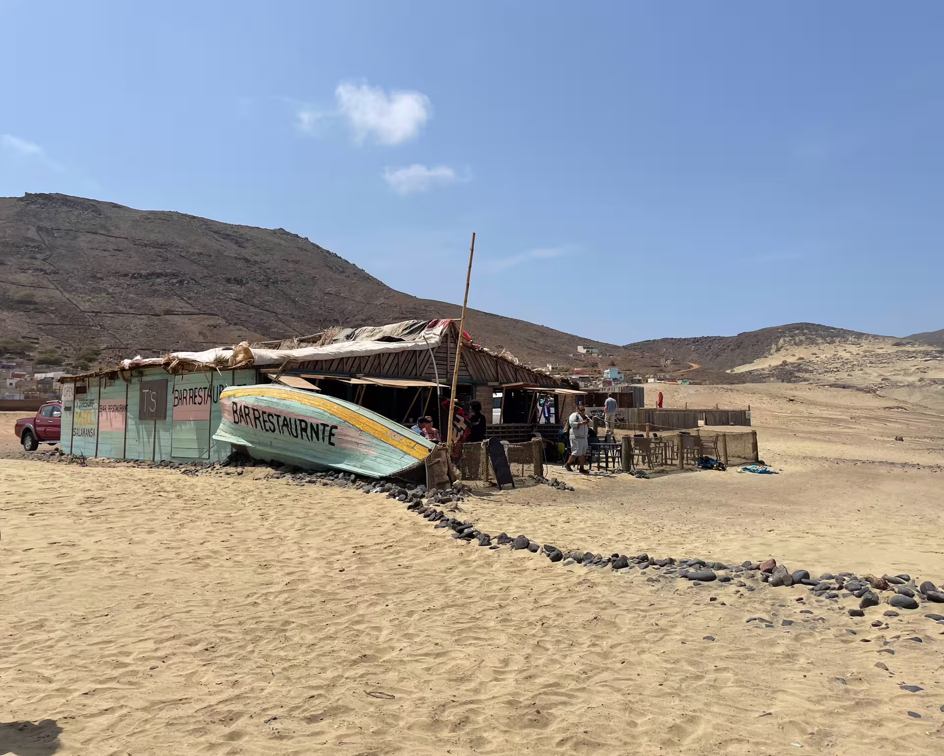 Rustic beachside restaurant in São Vicente's desert landscape, perfect for a cultural stop on a Mindelo highlights excursion.