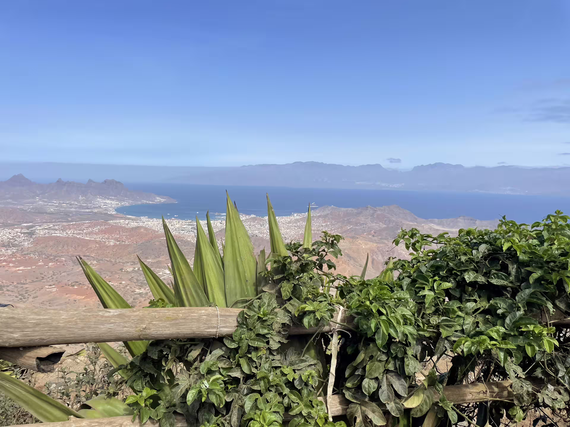 Scenic view from São Vicente island tour in Mindelo, showcasing stunning coastal landscape and lush greenery under clear blue skies.
