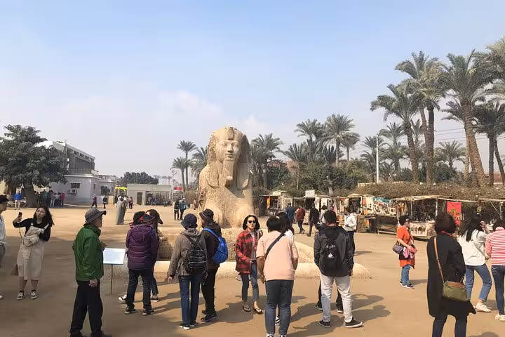 Tourists at the Memphis open-air museum by the Alabaster Sphinx on Saqqara and Dahshur day tour
