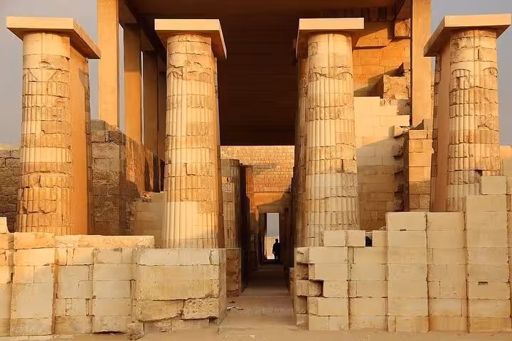 Saqqara necropolis temple columns in golden light, part of Cairo private tour to Giza and Saqqara with lunch
