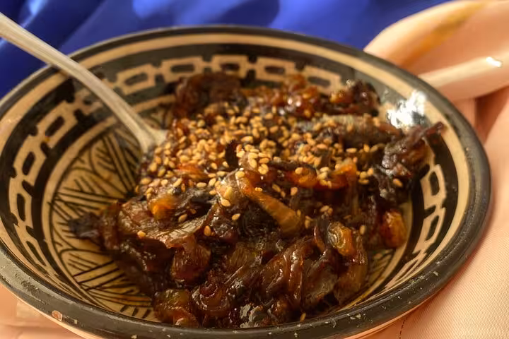 Traditional Moroccan dish with sardines and sesame seeds prepared during Sardin Tawa Cooking Class Marrakesh.