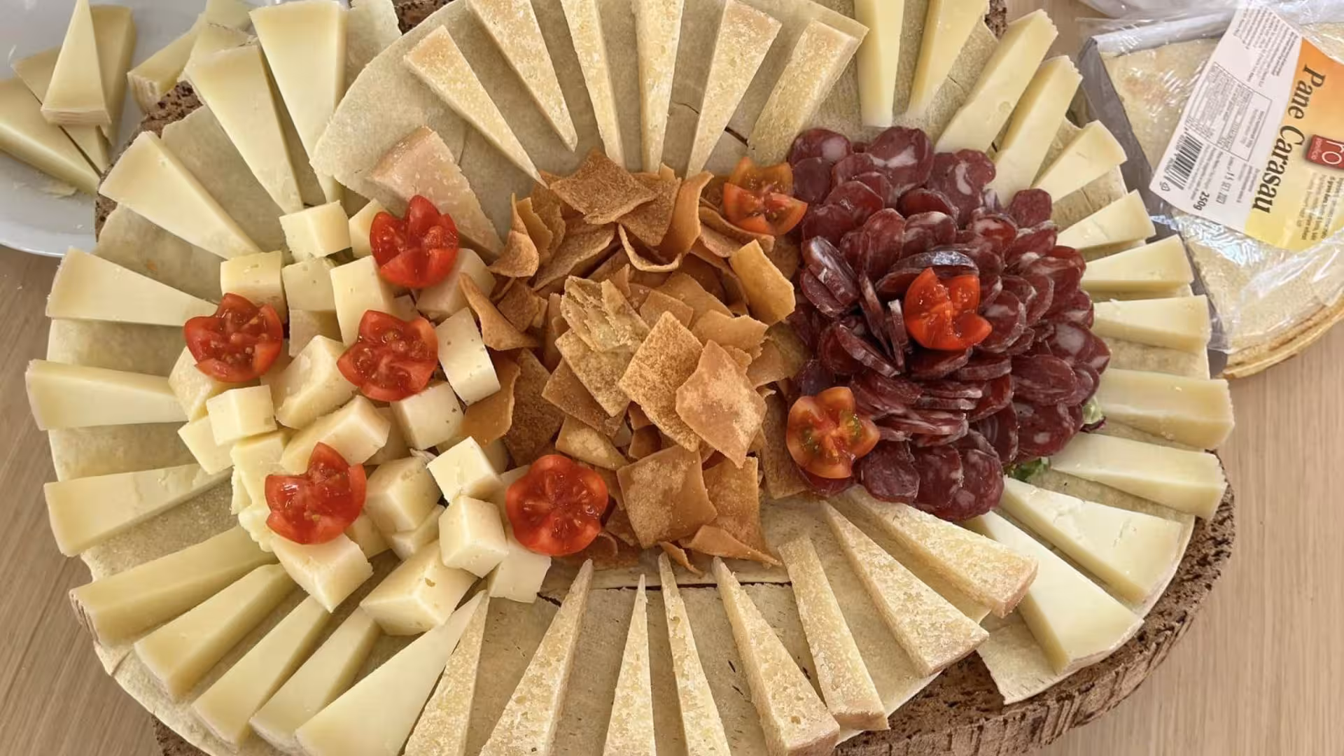 Traditional Sardinian cheese and salami platter on a sailing journey to La Maddalena Archipelago from Santa Teresa di Gallura.
