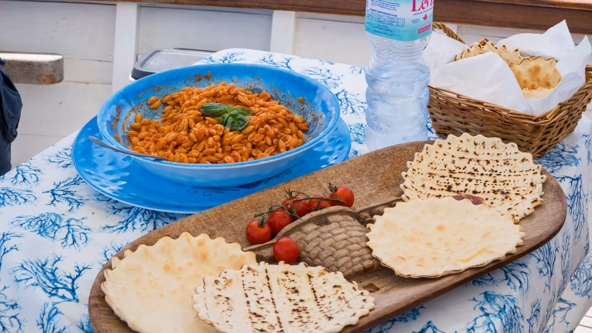 Traditional Sardinian pasta and flatbread served on a scenic Asinara sailing excursion.