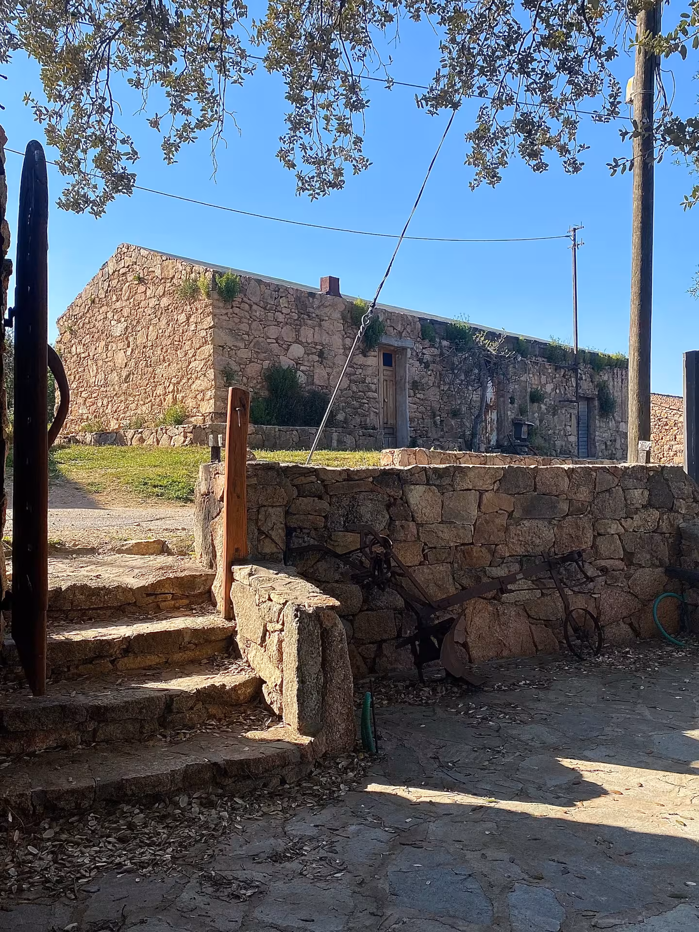 Charming stone building in Olbia's ancient village, site of a Sardinian pasta workshop experience.