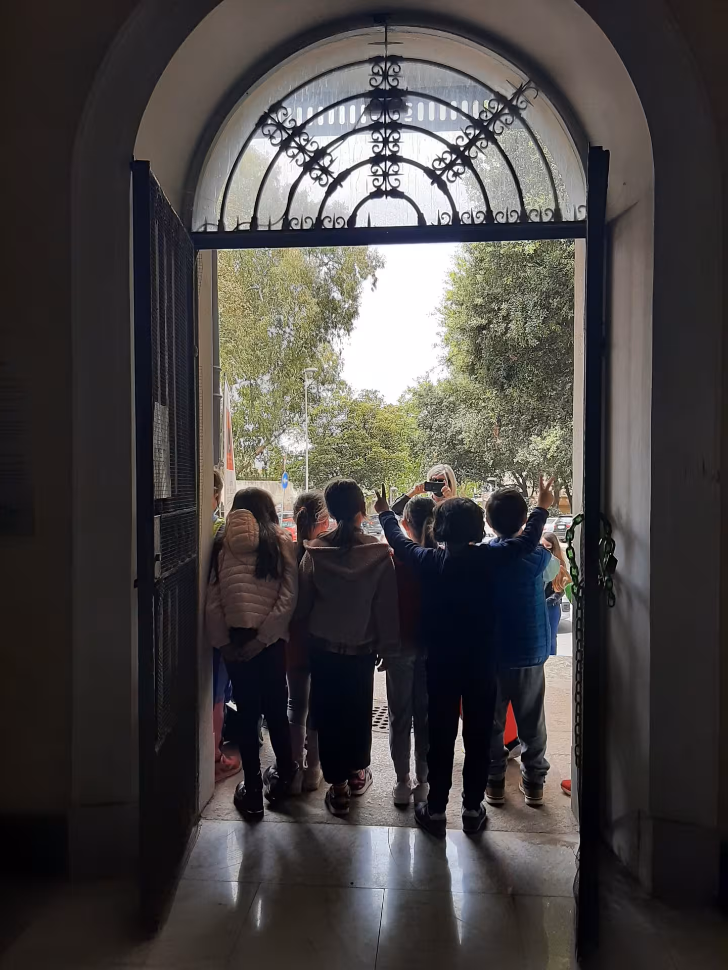 Children eagerly explore the entrance of Sassari's Ecomuseum, offering a gateway to marine and water heritage.