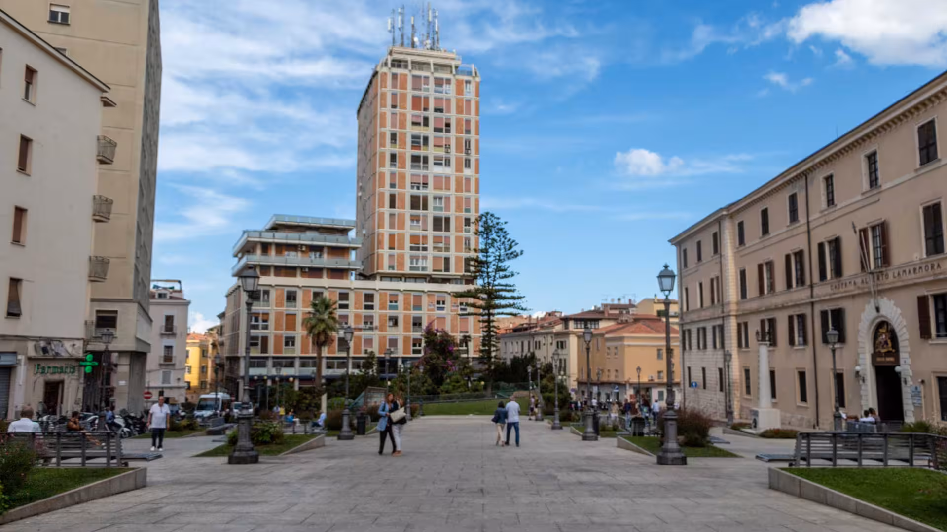 Vibrant Sassari city square with modern and historic buildings, an ideal spot for exploring the town's rich culture.