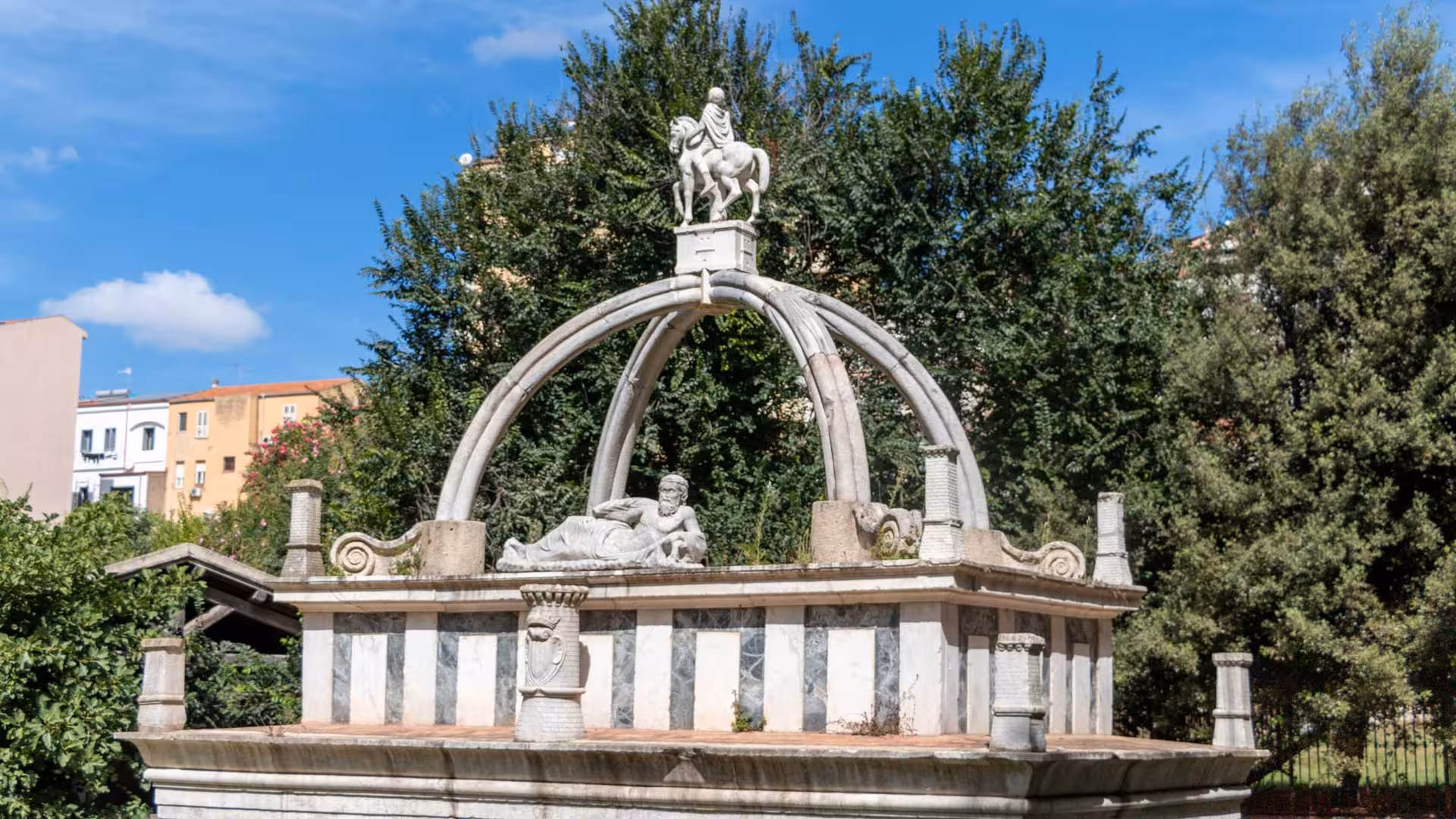 Discover the intricate stone carvings of a historic fountain in Sassari's vibrant city center on this cultural tour.
