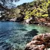 Crystal-clear cove in the Calanques near La Ciotat, ideal stop on a guided sea kayak tour along cliffs